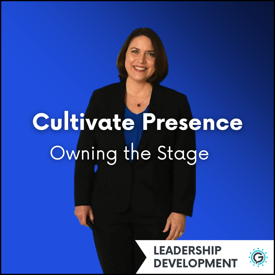 Woman in a black suit standing against a blue background with text. GettaMeeting's
