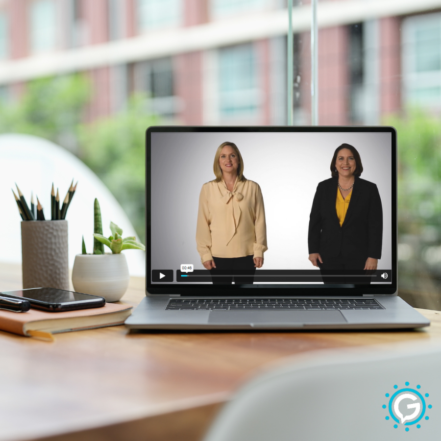 A GettaMeeting module presentation video playing on a laptop on a desk.